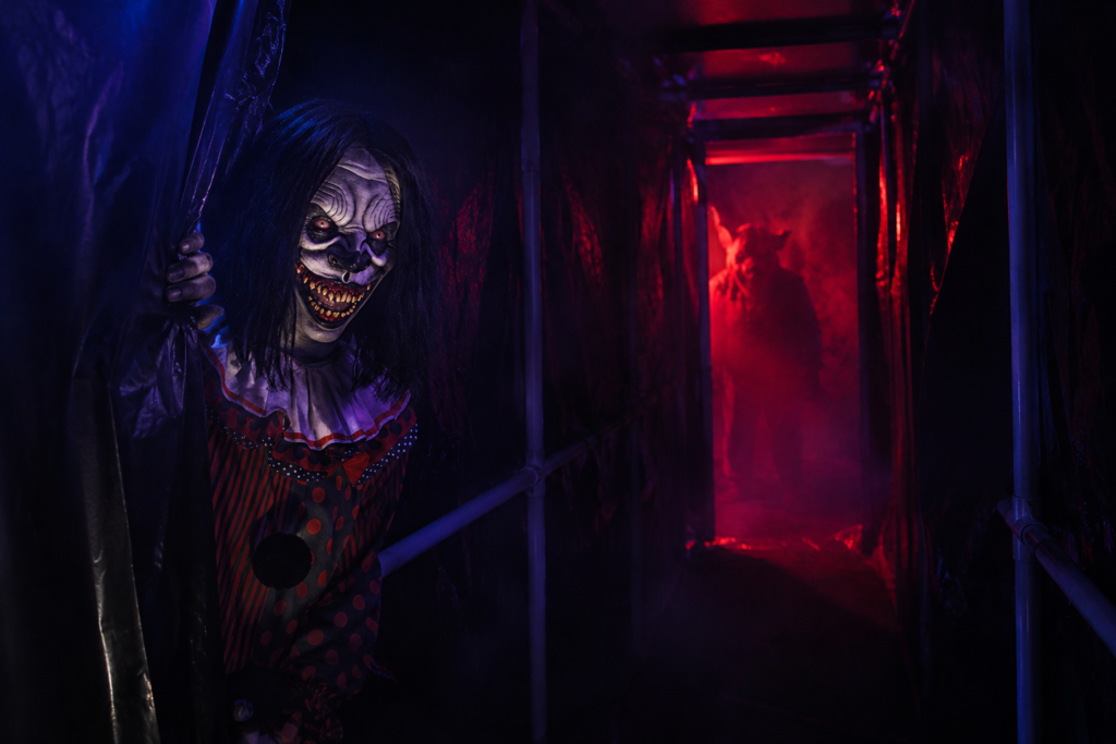 Creepy clown in haunted corridor